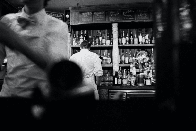 Bar staff serving drinks